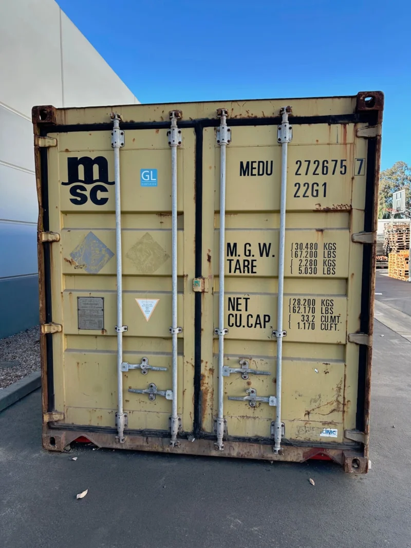 used 20ft conex shipping / storage container – yellow/gold