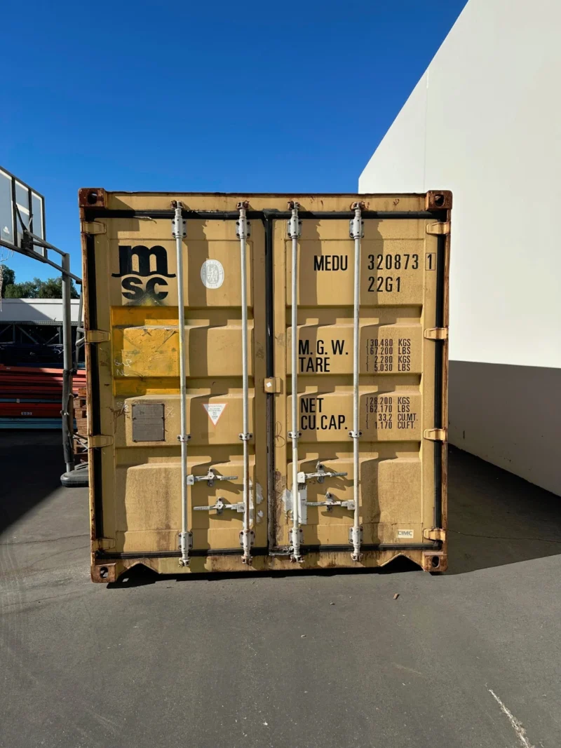 used 20ft conex shipping / storage container – yellow/gold